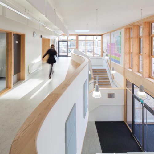 interior of building with blurred figure walking