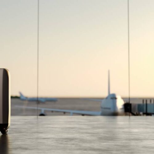 airport with passenger in foreground of airplanes taking off