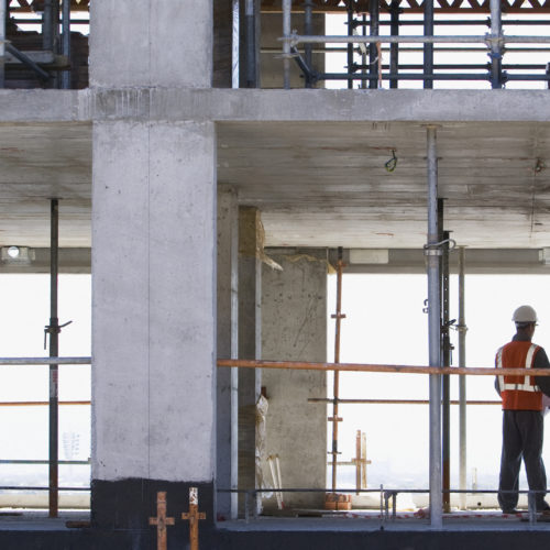 Construction workers standing together on construction site