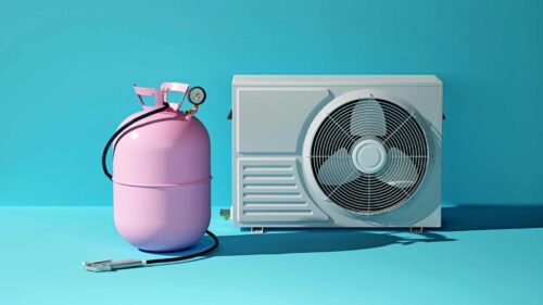 pink tank for refilling freon next to the air conditioning system